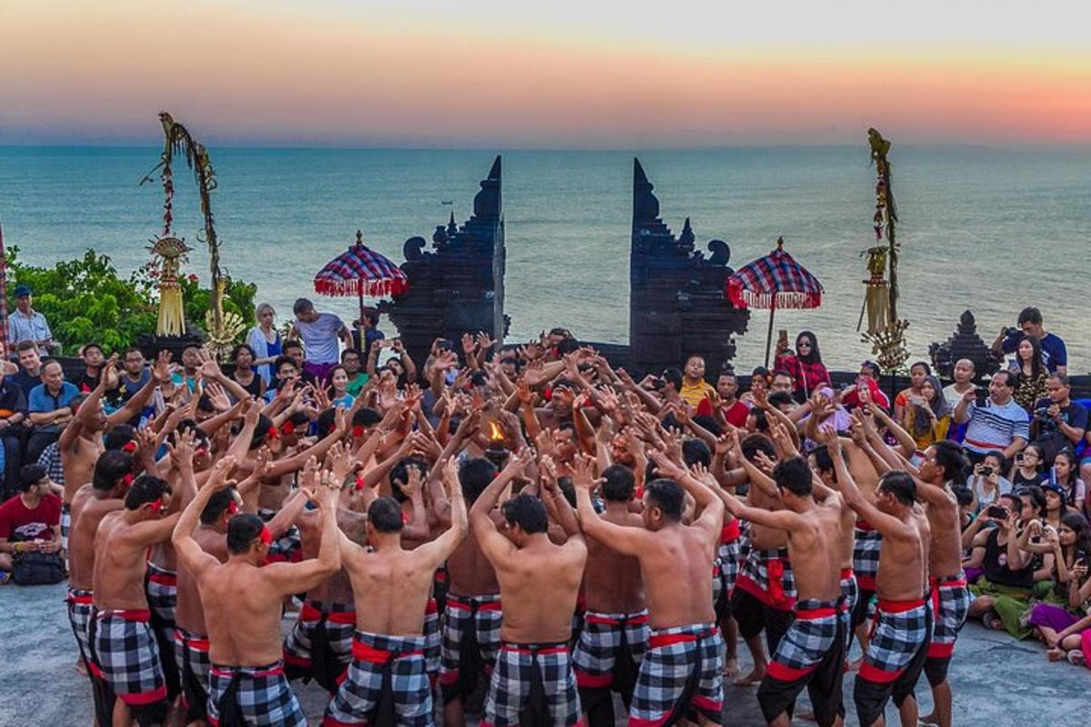 un grup de bărbați făcând o poziție de yoga pe plajă