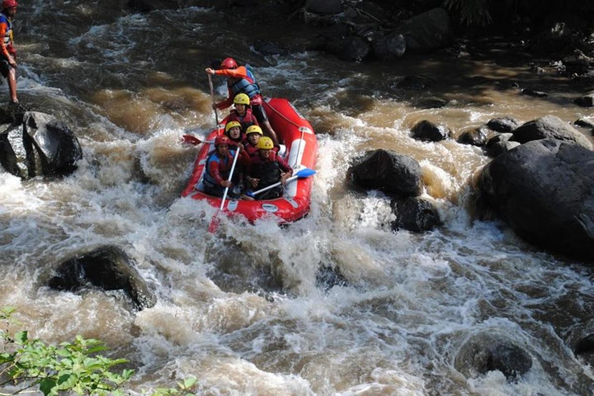a group of people in a raft in a river