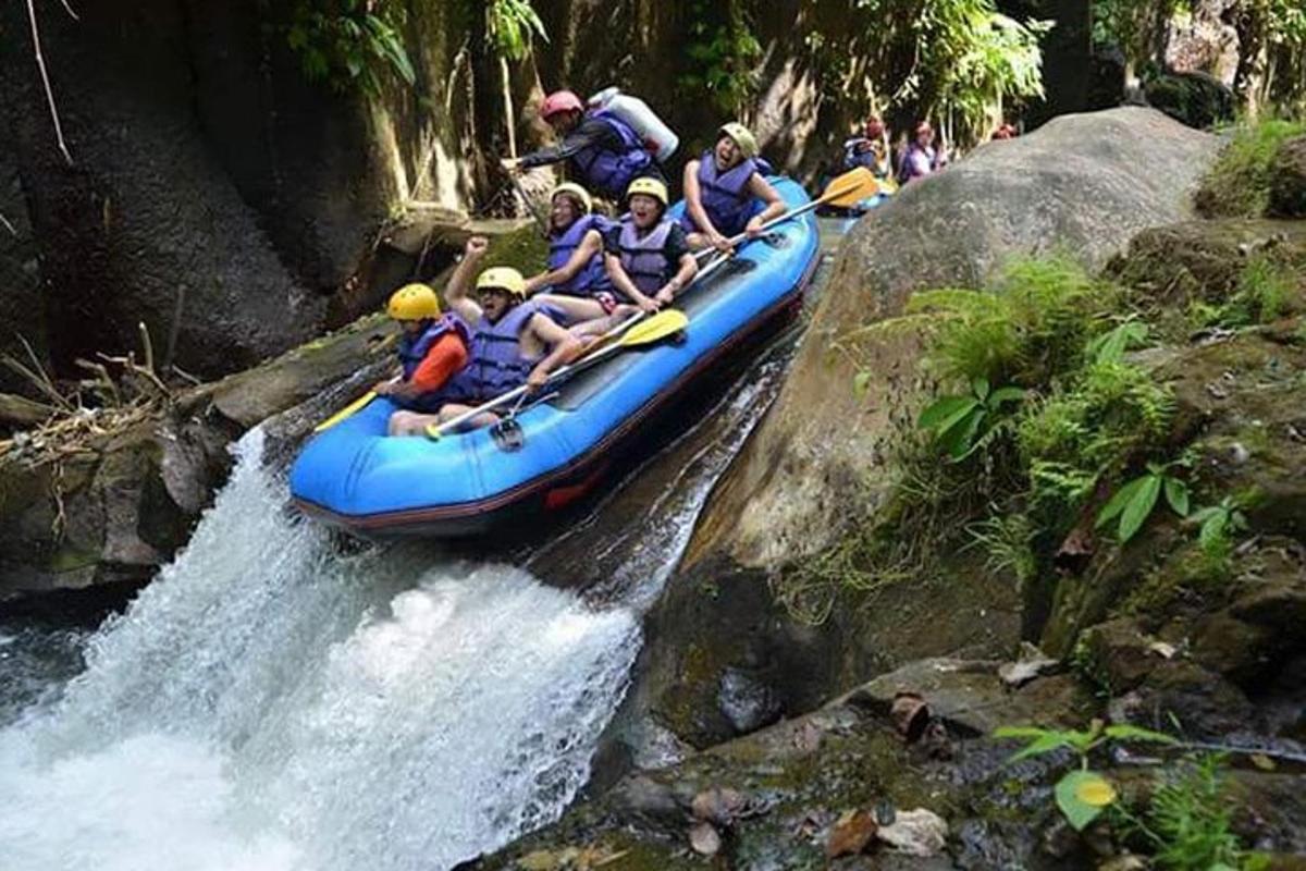 a group of people in a raft on a river