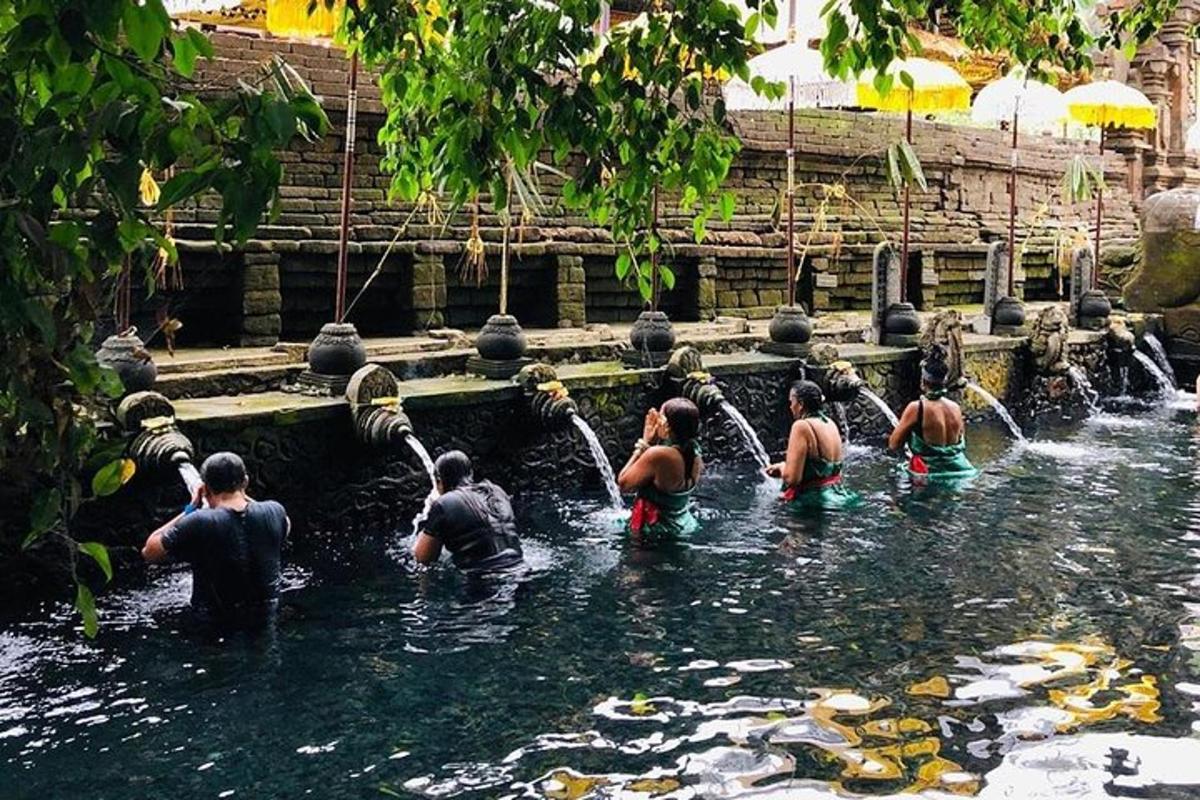 a group of people playing in the water