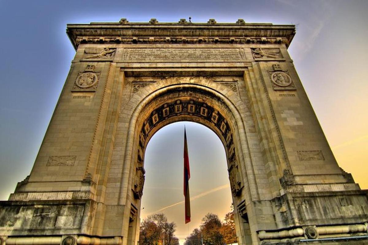 a large monument with a flag in front of it
