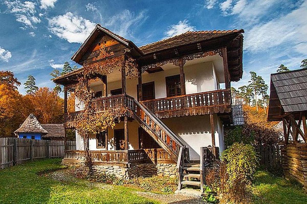 an old house with a staircase in front of it