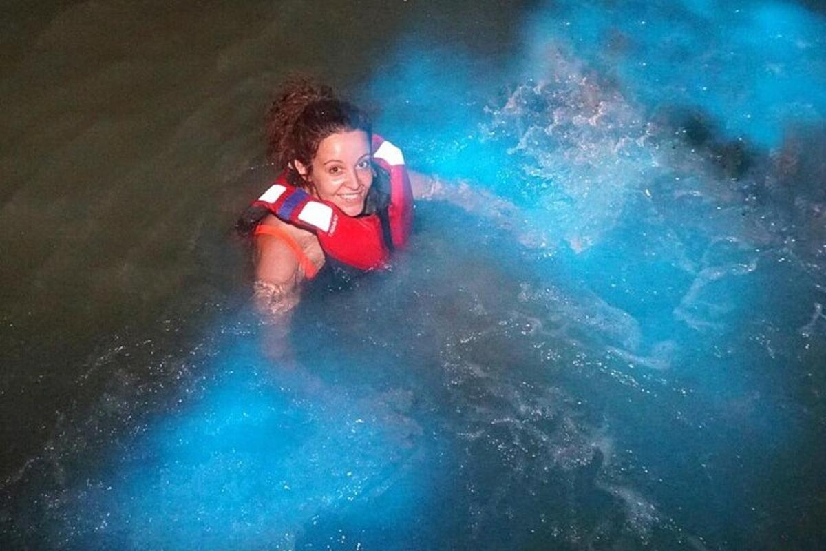a young girl is swimming in the water