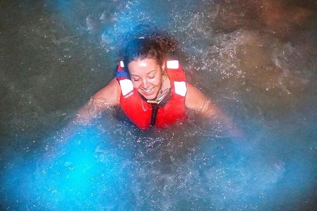 a person in water wearing a life vest