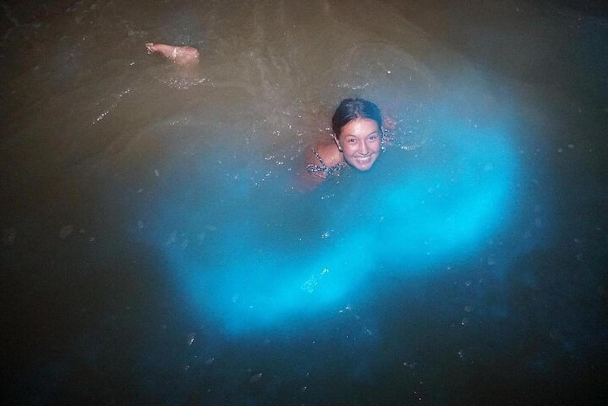 a man swimming in a pool of water