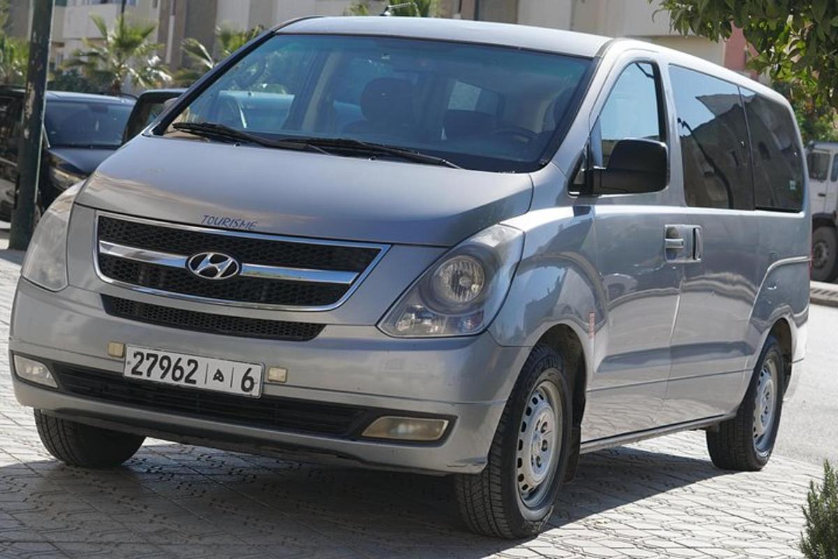 a silver van parked on a street