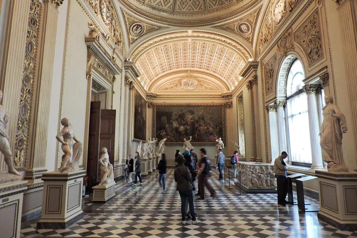 a group of people standing in a large room with a painting