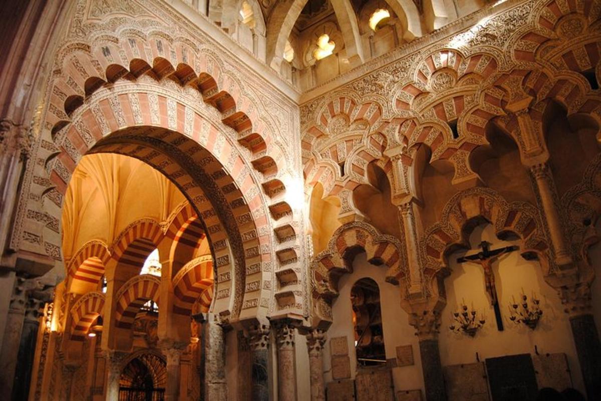 a church with ornate ceilings and arches on the wall