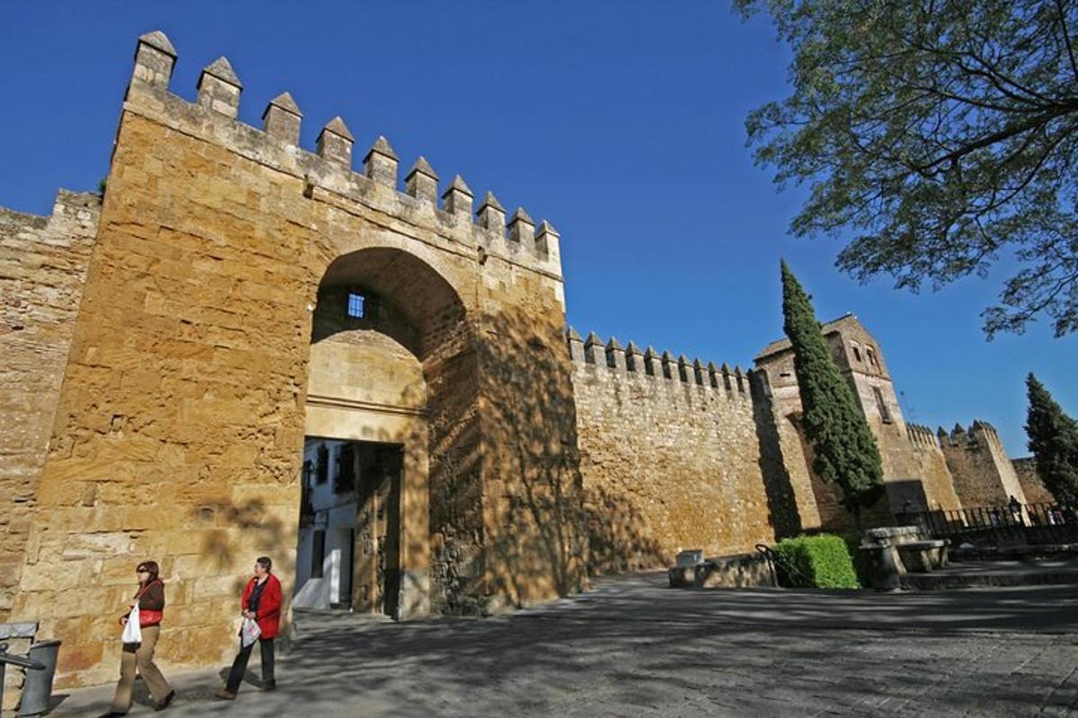 two people walking in front of a building