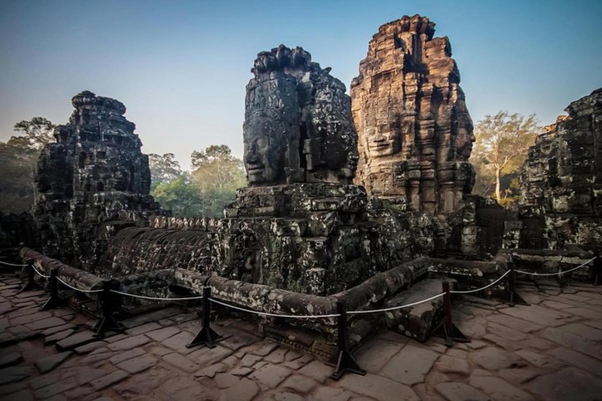 a stone temple with two towers in the foreground