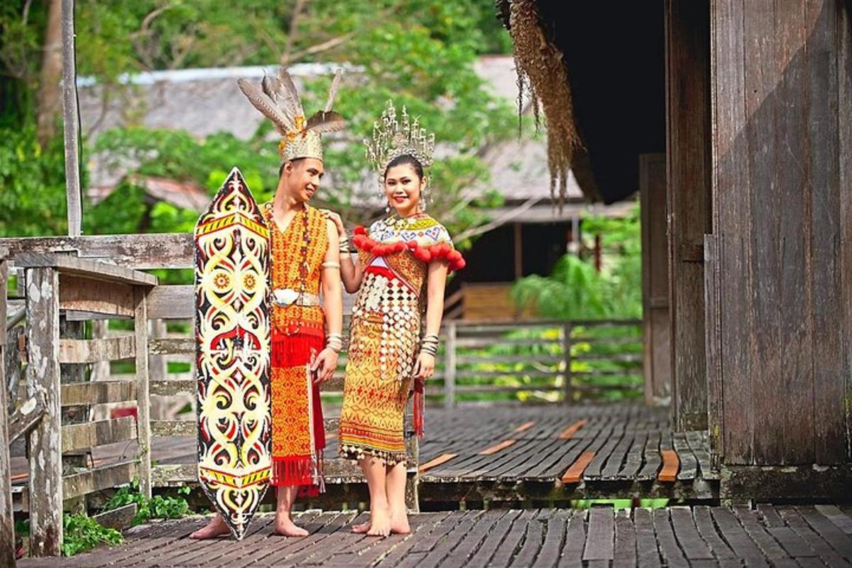 two girls in traditional dress standing on a wooden deck