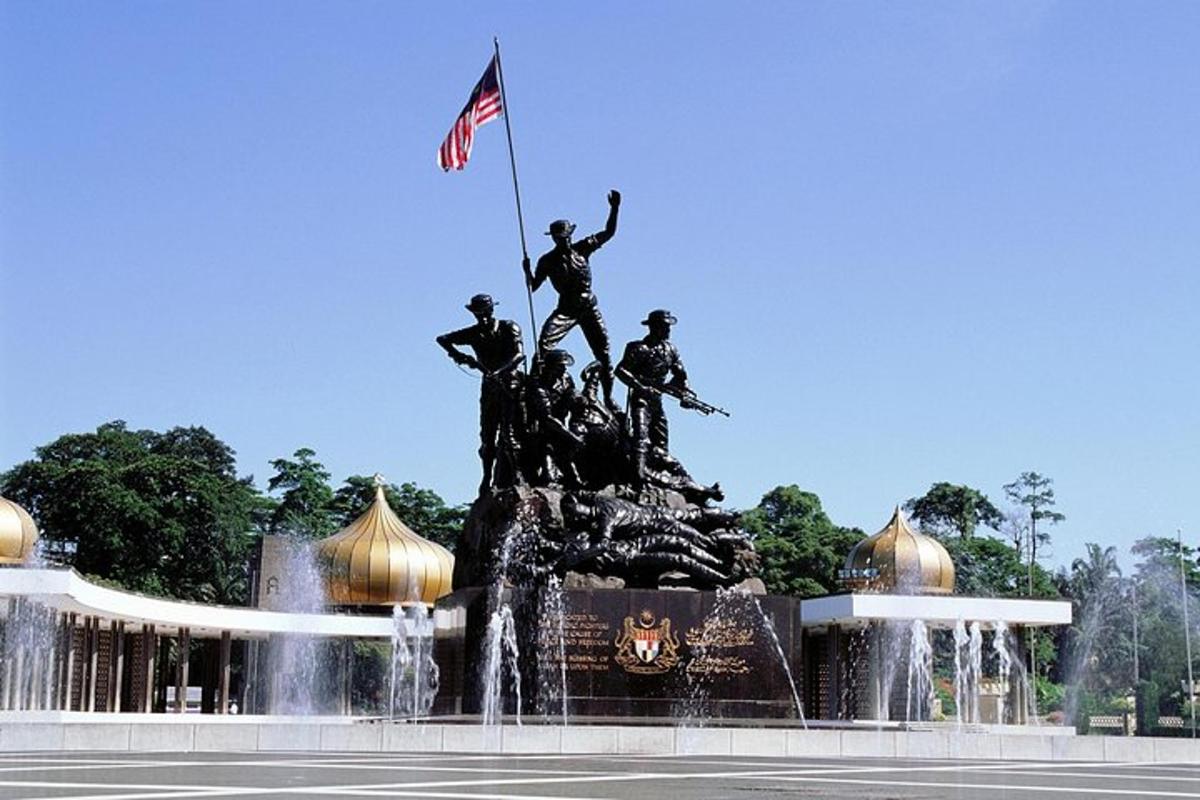a statue of people on a horse in a fountain