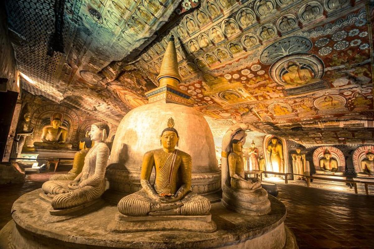 a group of statues in a room with a ceiling