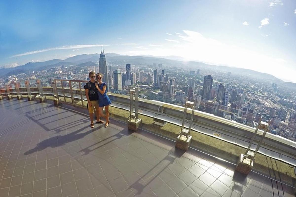 two women standing on the top of a building
