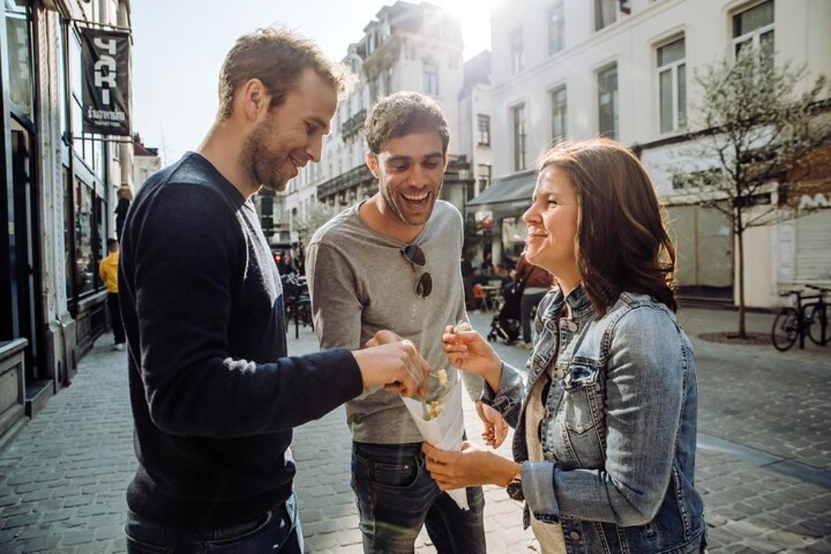 a group of three people standing on a street