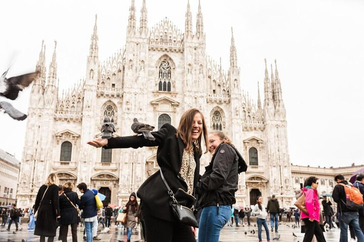 two people standing in front of a cathedral