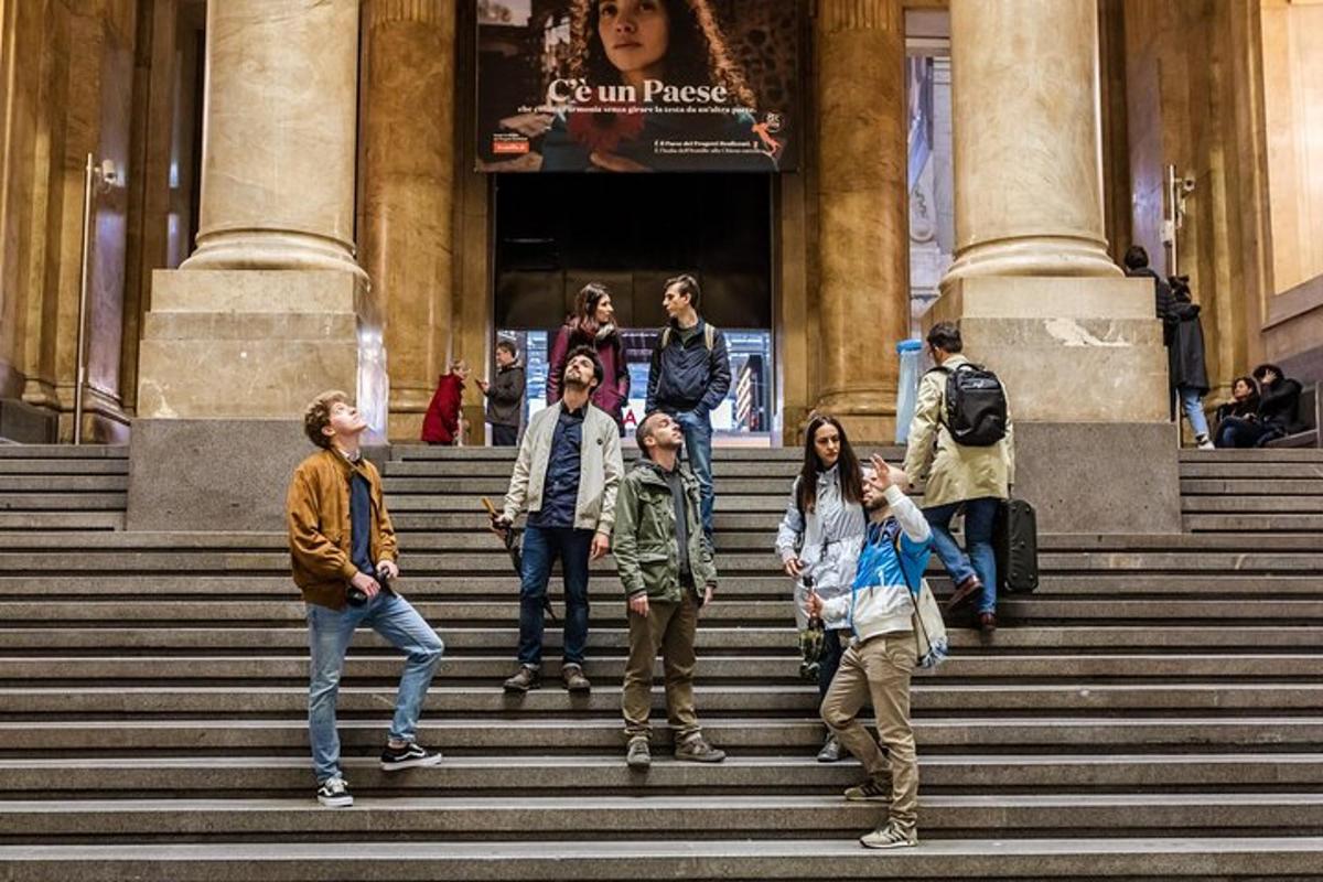 a group of people standing on steps in front of a building
