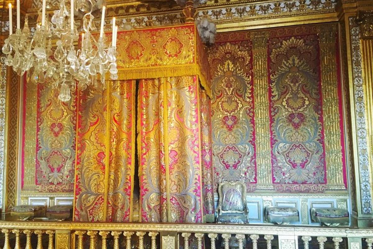 a room with a curtain and a chandelier