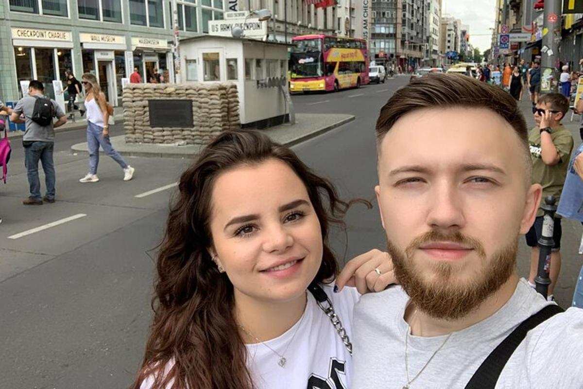 a man and a woman standing on a city street