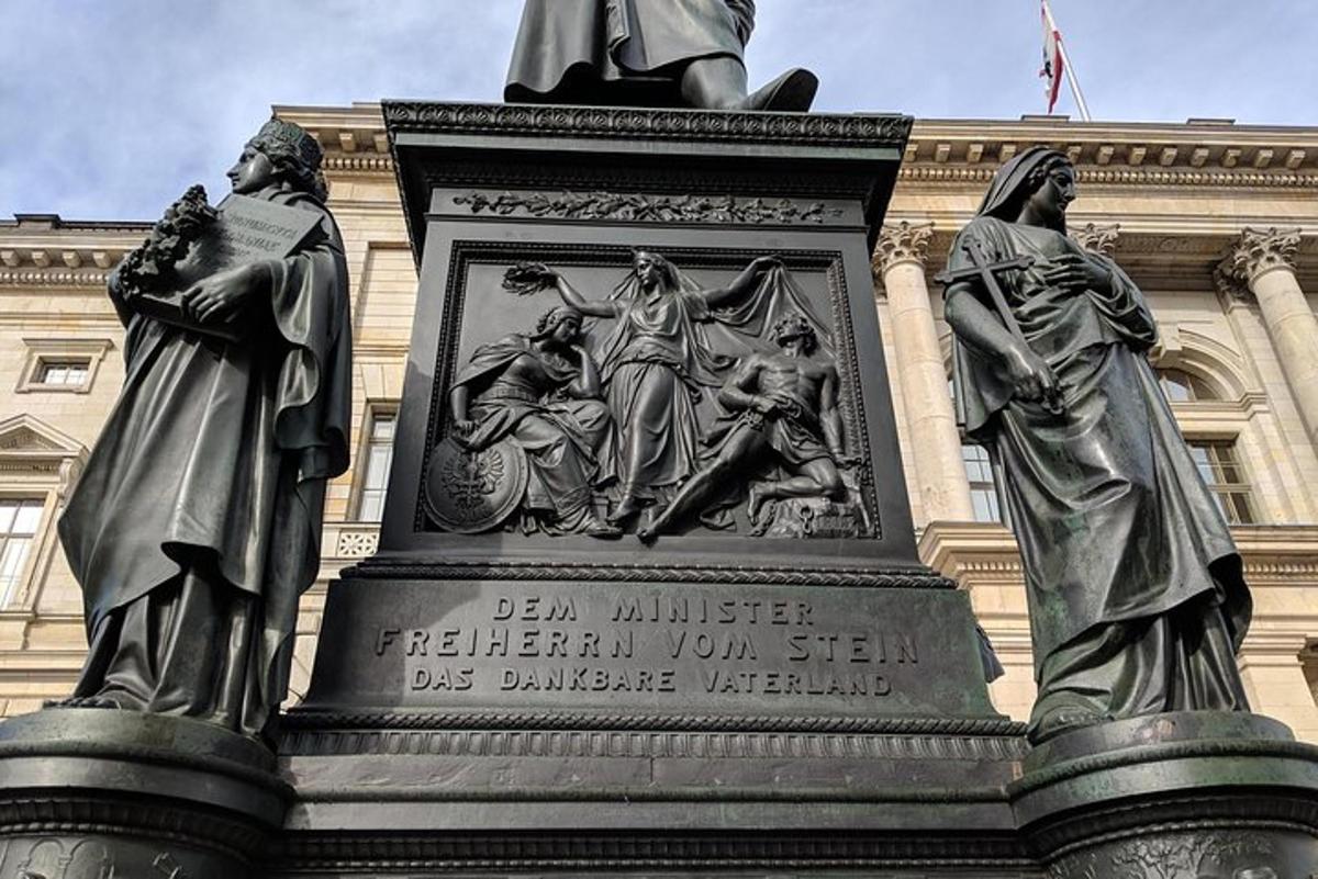 a statue of two women in front of a building