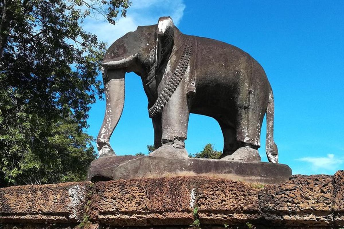 a statue of an elephant on top of a building