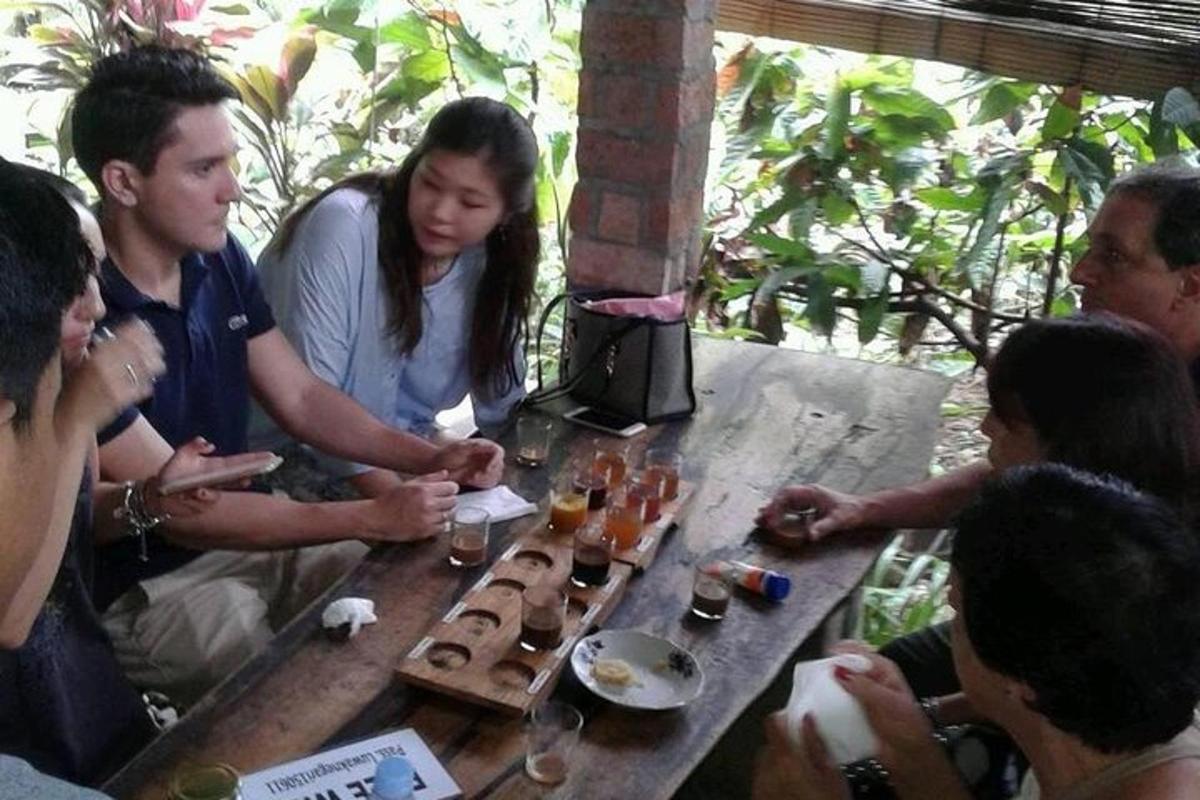 a group of people sitting around a table with drinks