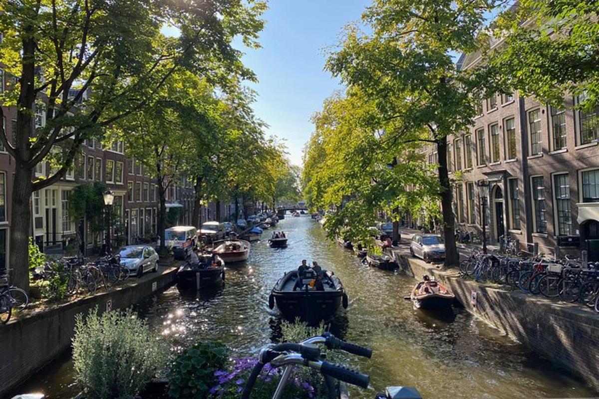 a group of boats on a canal in a city