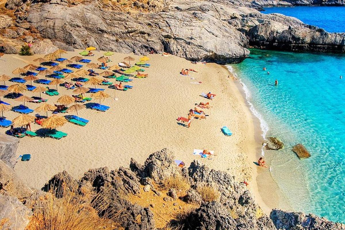a group of people laying on a beach with umbrellas