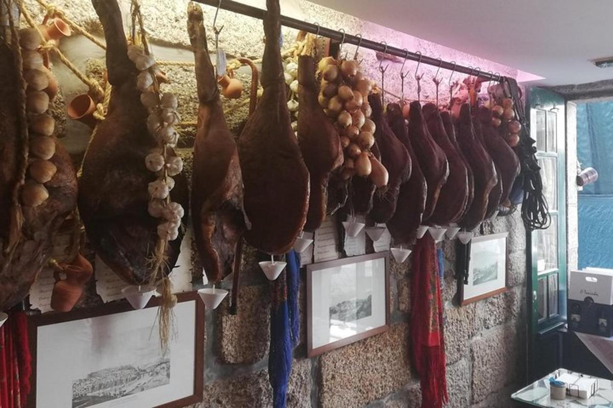 a bunch of meat hanging on a wall
