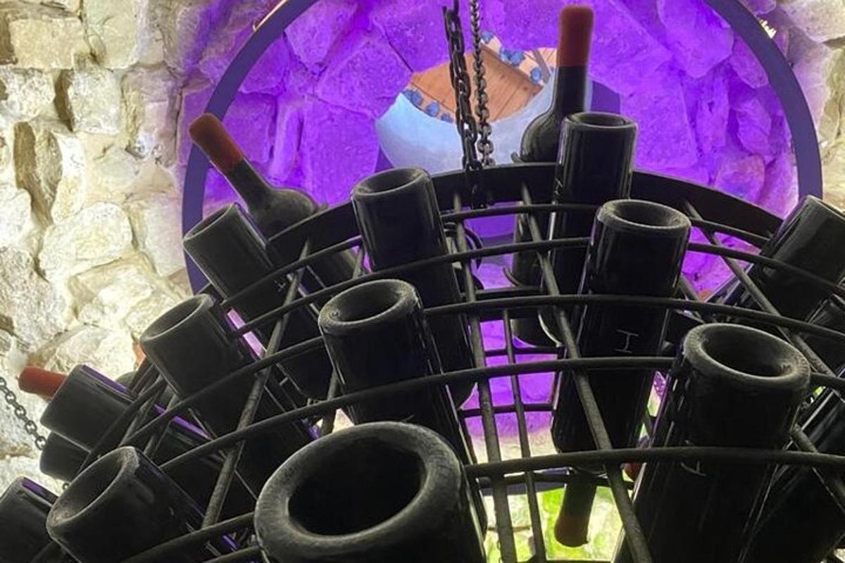 a bunch of wine bottles in a wine rack