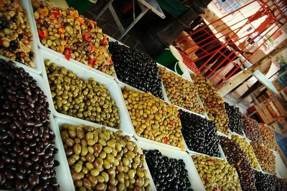 a bunch of different types of olives on display