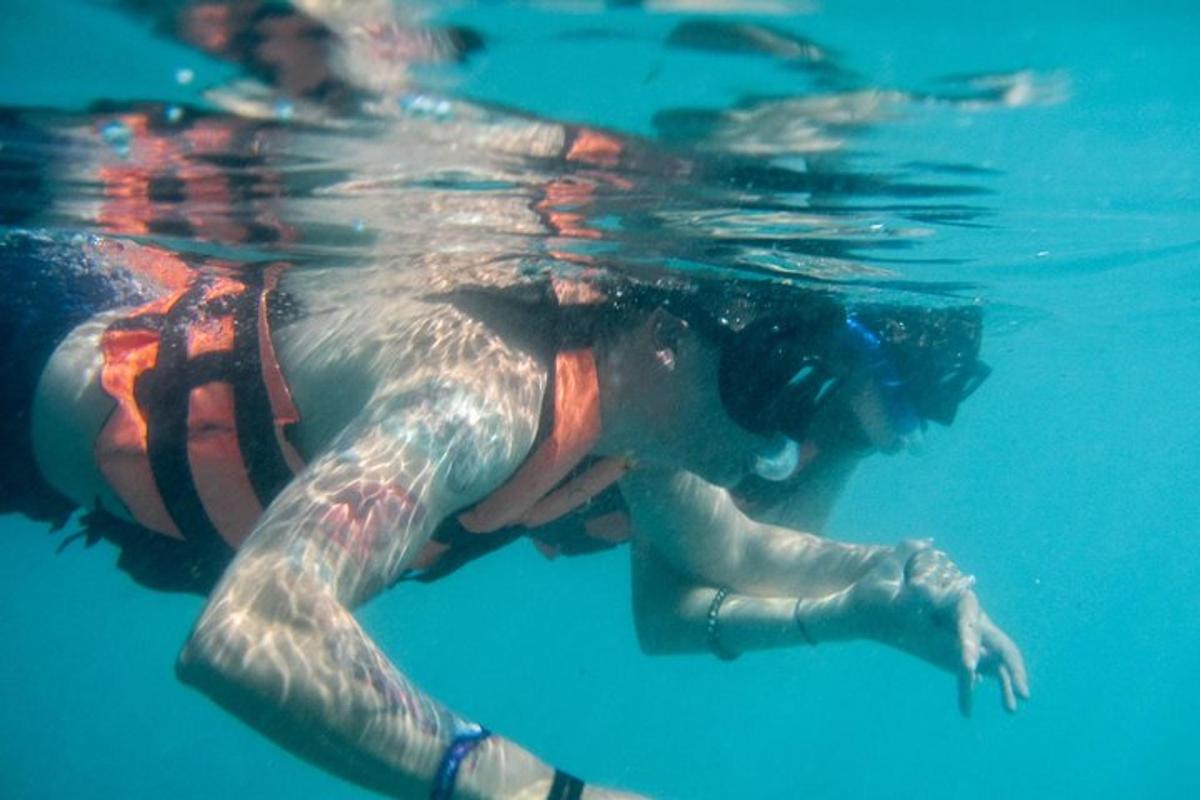 a woman is swimming in the water