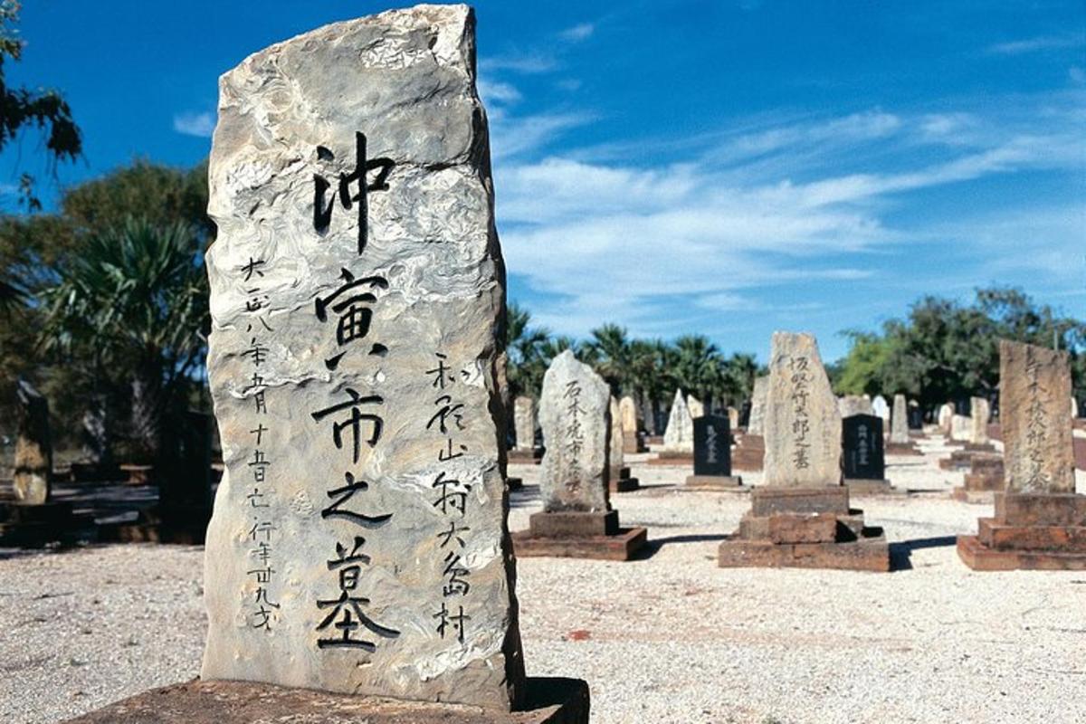 a stone monument with writing on it in a cemetery