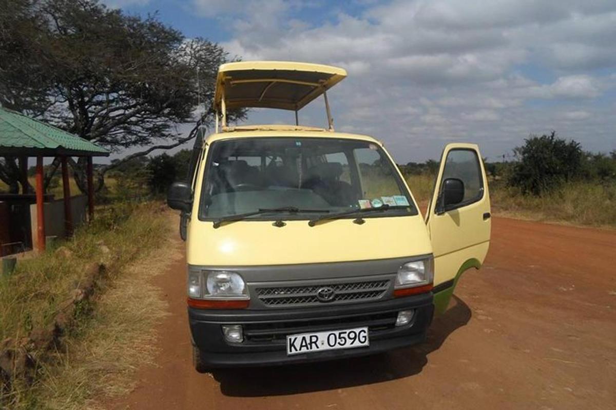 a yellow van parked on the side of a dirt road