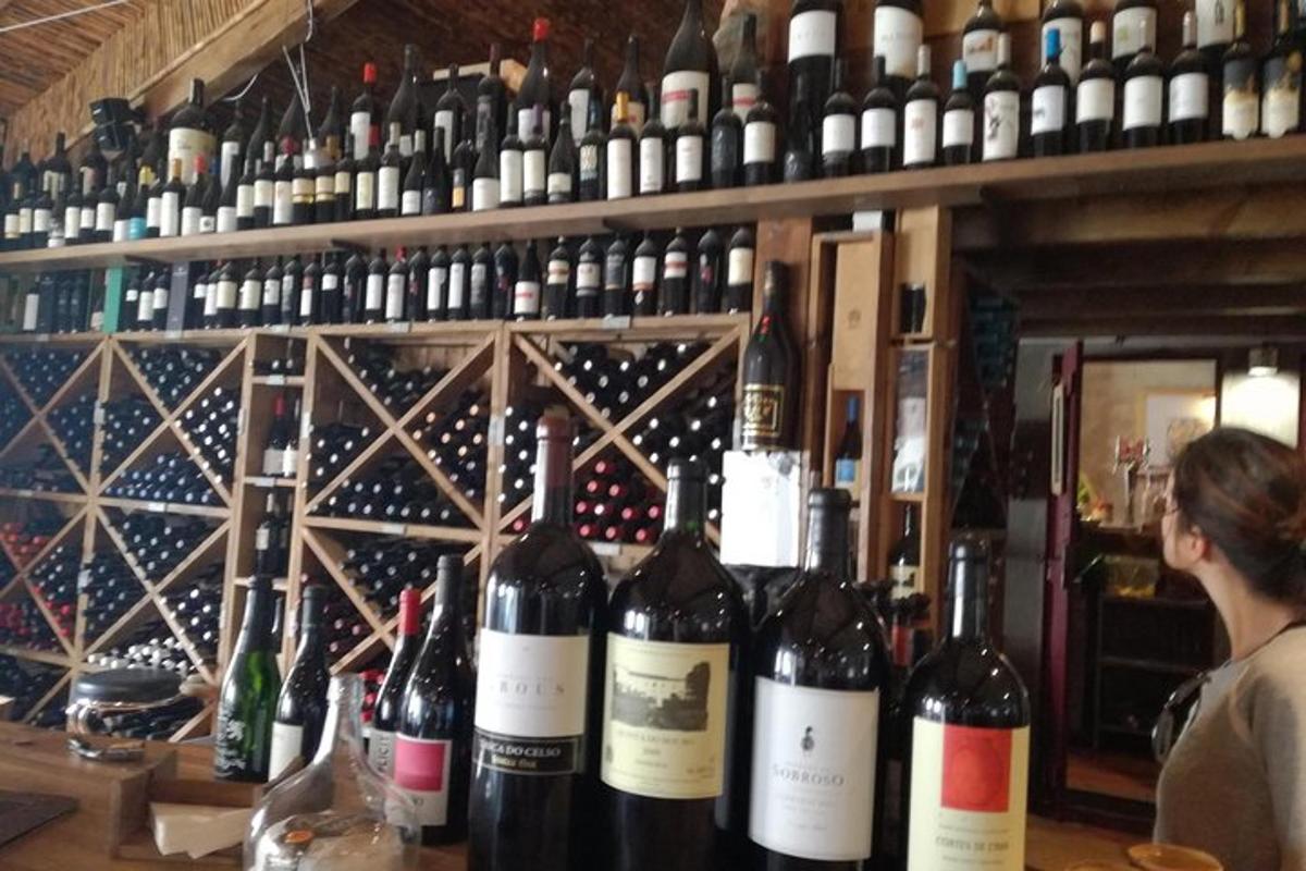 a bunch of bottles of wine on a shelf