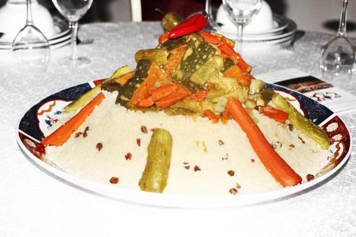 a plate of food with vegetables on a table