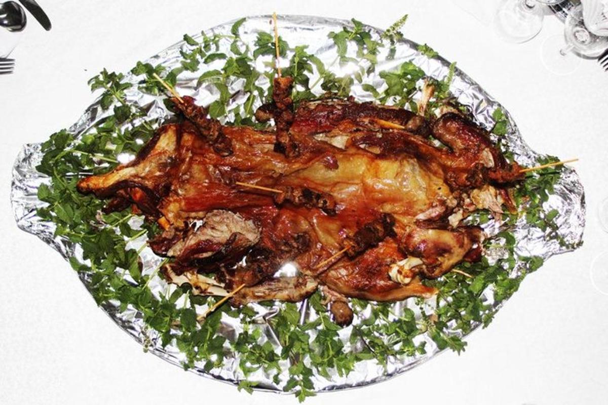 a chicken on a glass plate with greens