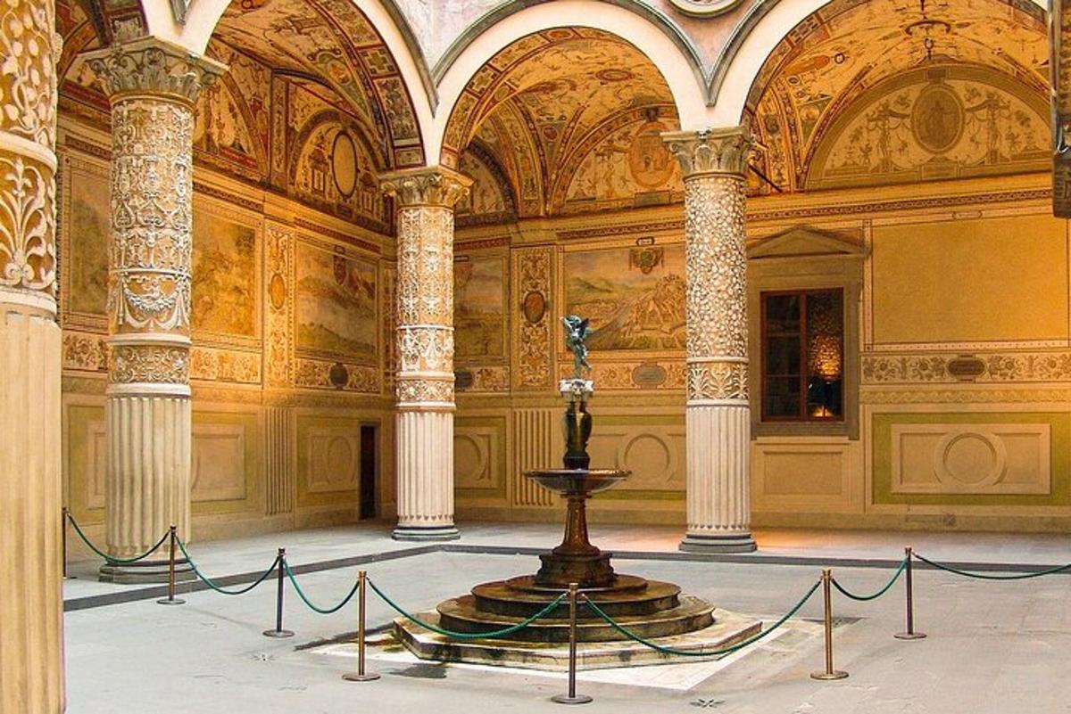 a room with a fountain in the middle of a building