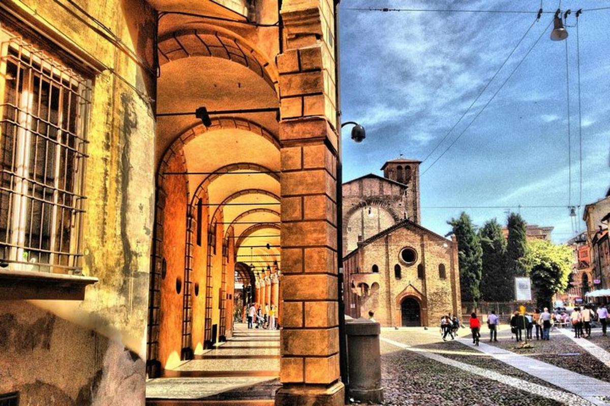 a building with an archway next to a church