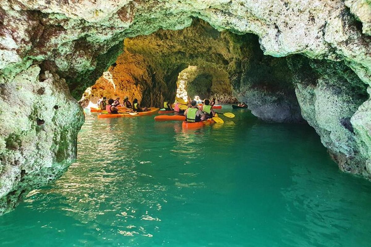 a group of people in kayaks in a cave