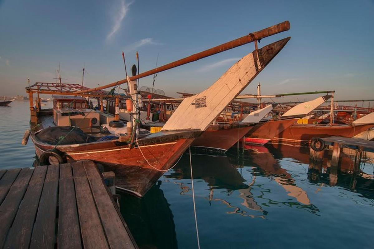 a group of boats are docked at a dock