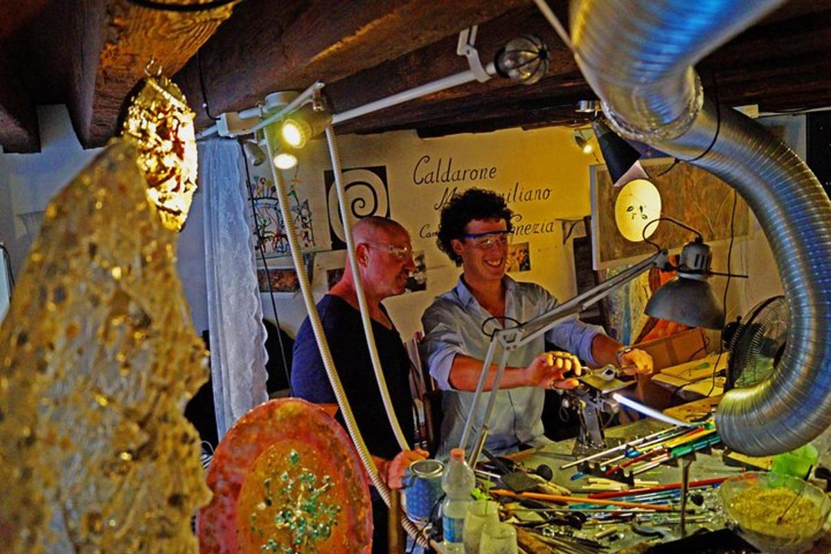 two men are standing behind a counter in a shop