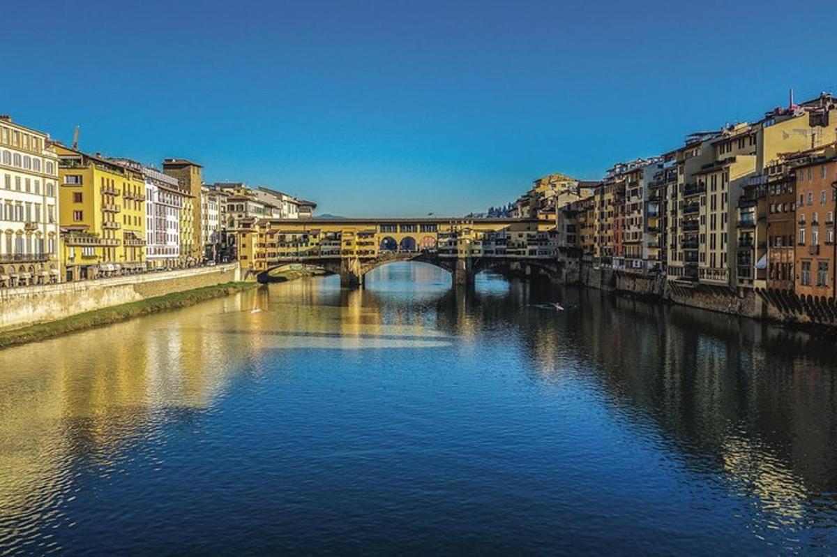 a bridge over a river in a city with buildings