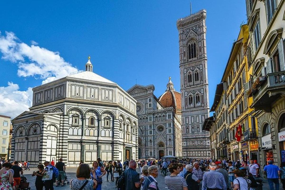 a crowd of people standing in front of a large building