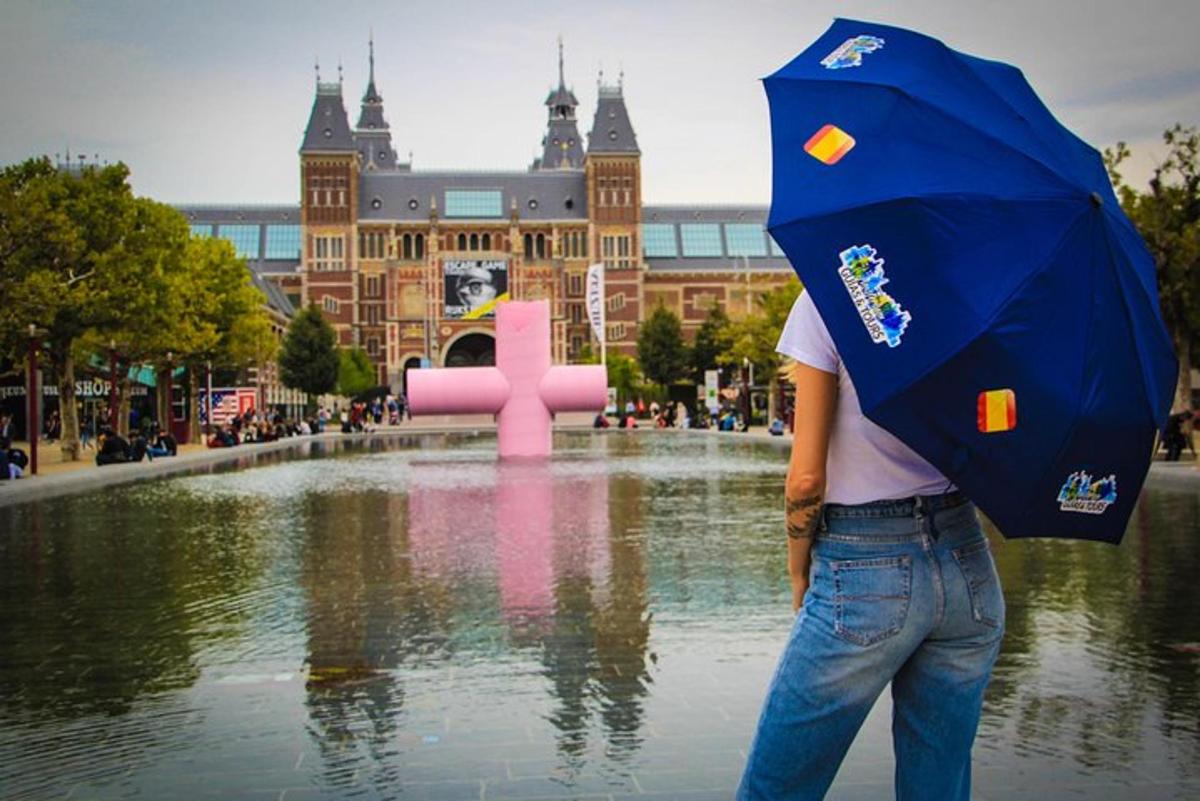 a person with an umbrella standing in front of a fountain