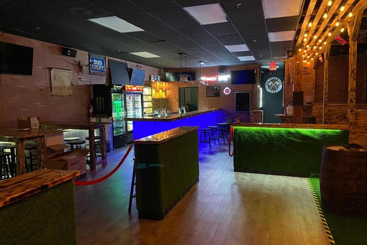 a restaurant with a bar with green and blue