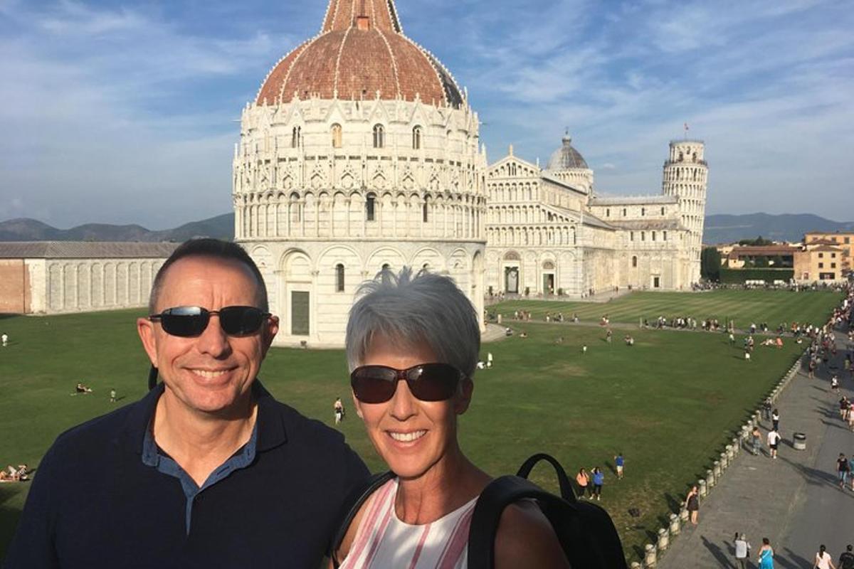 a man and a woman standing in front of a building
