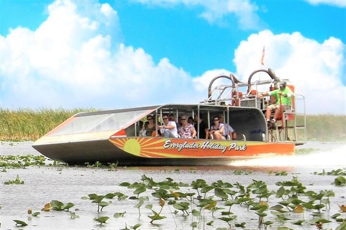 a group of people riding a boat in the water