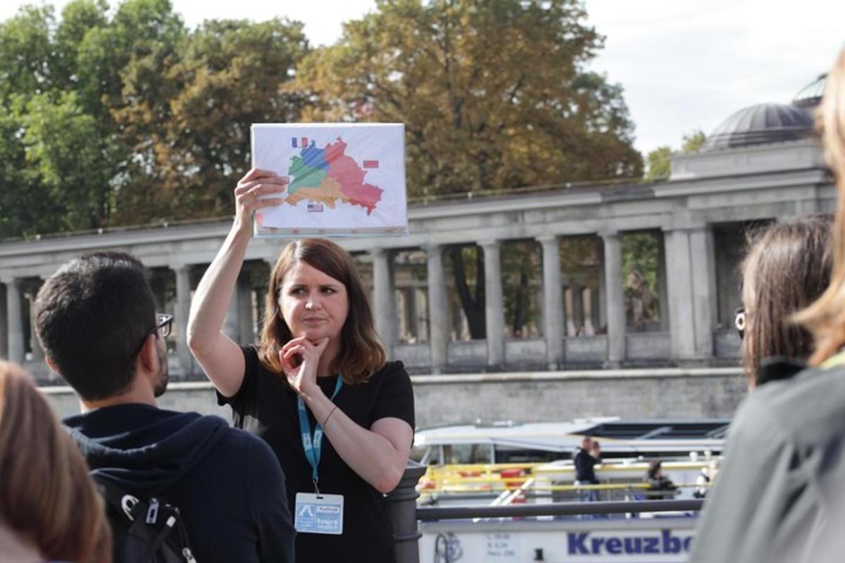 a woman holding up a sign in a crowd of people
