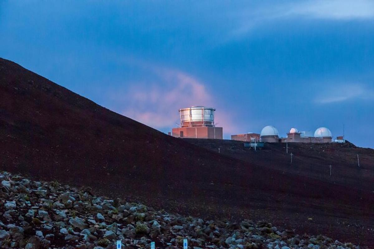 a hill with a light house on top of it